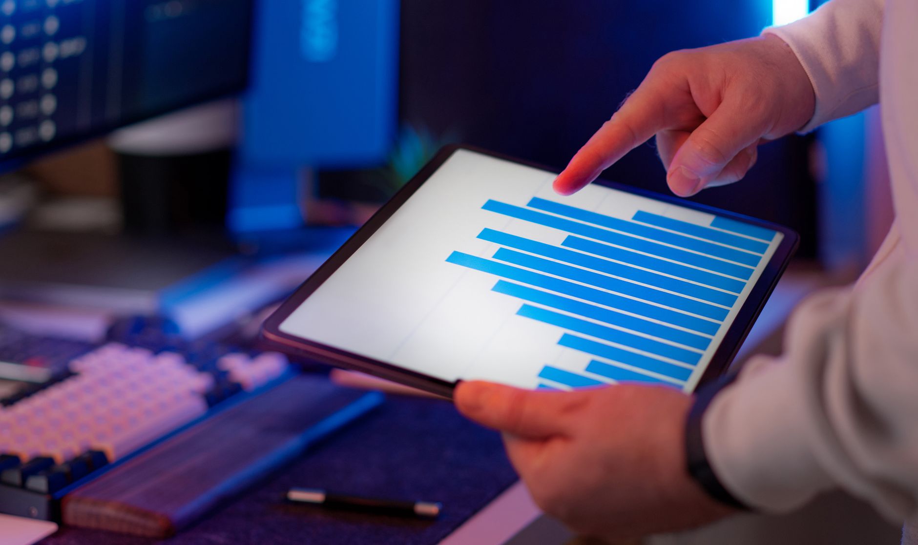 Professional holding digital document reports on tablet